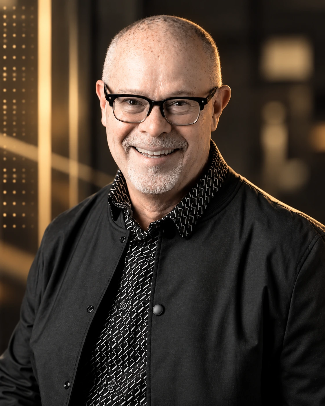 Portrait of Clint Hansen in a warm, cinematic studio setting